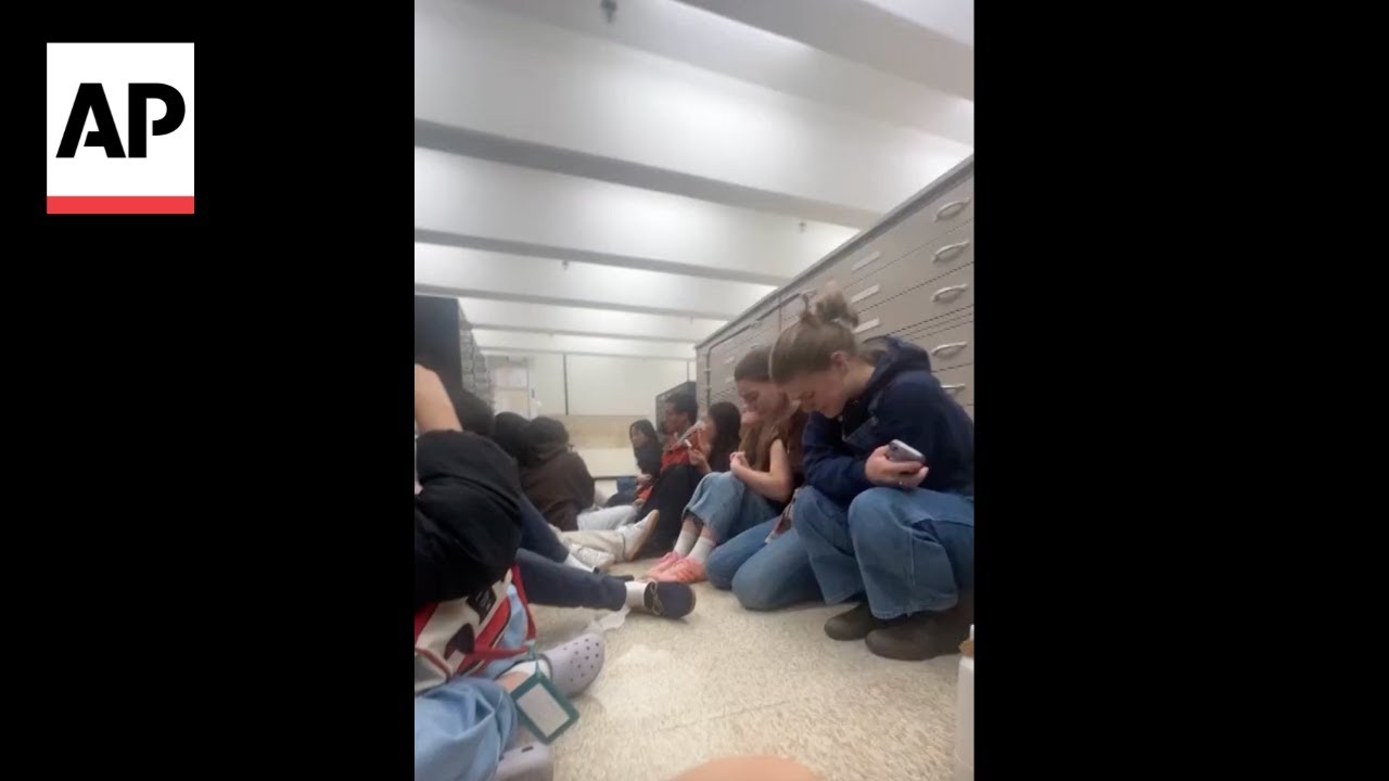 Video shows students hunkered down at Brown University as police arrive after shooting