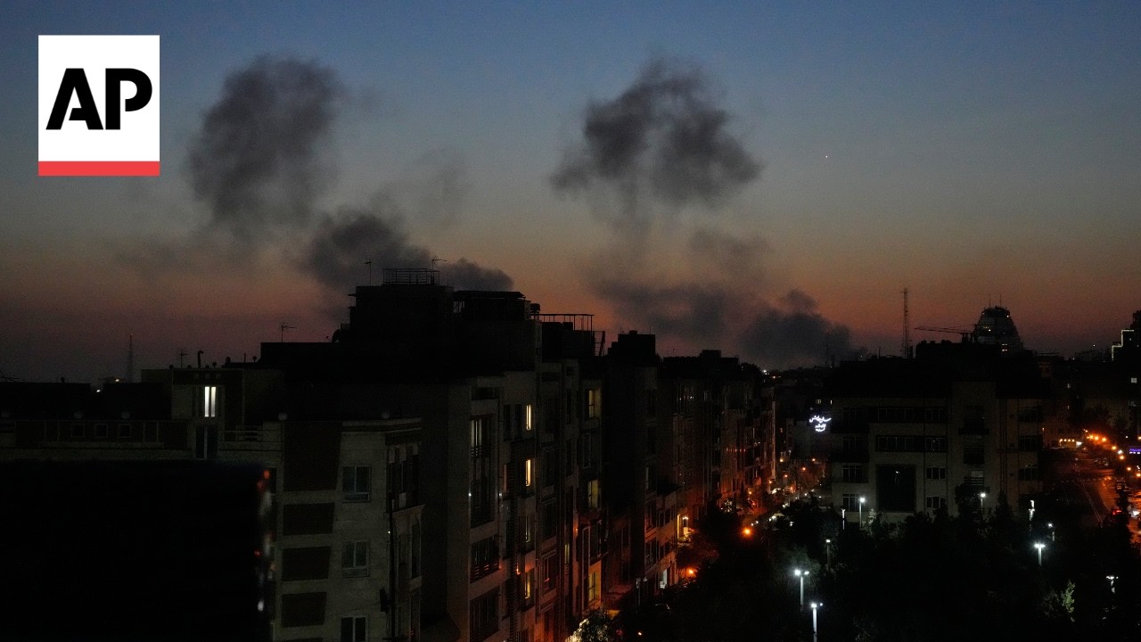 Explosions light up the sky following airstrikes on western Tehra