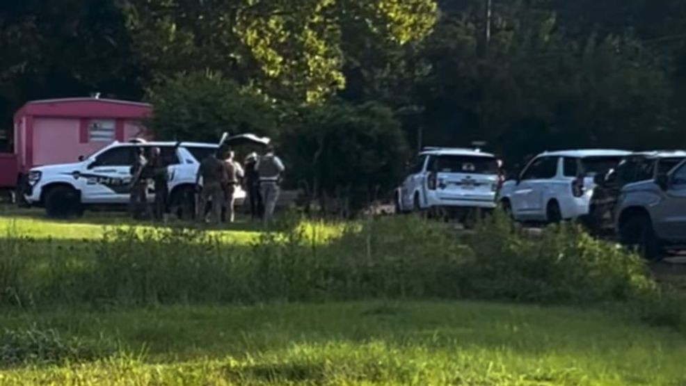 Man who says he has gun refuses to come out of trailer when deputies arrive with warrant