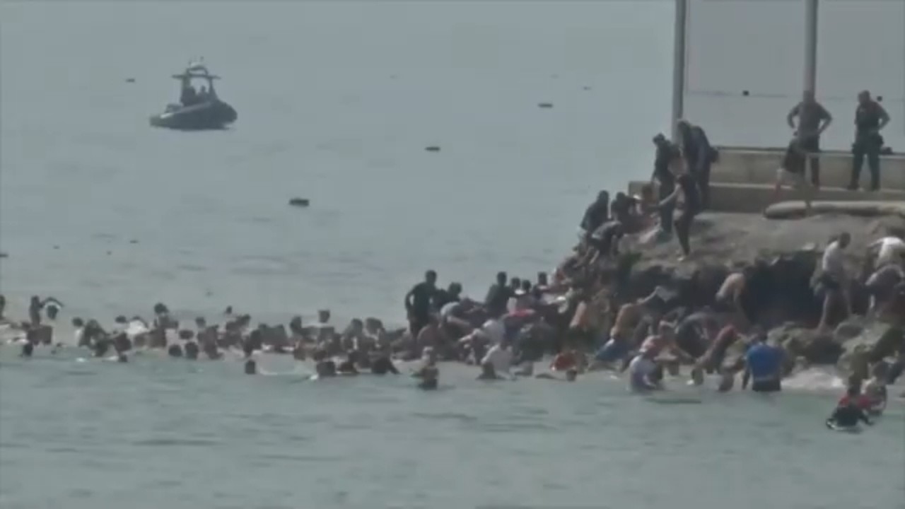 Spain deploys military to border as migrants swim from Africa